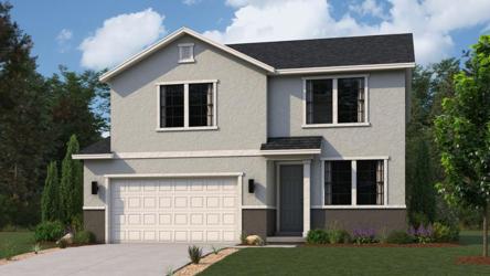 A house with a garage with Ronald Reagan Boyhood Home in the background.