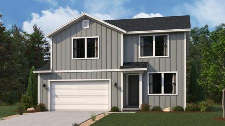 A white house with a garage.