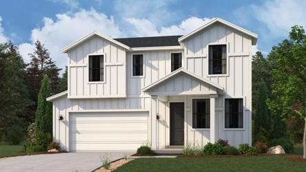 A white house with a lawn.