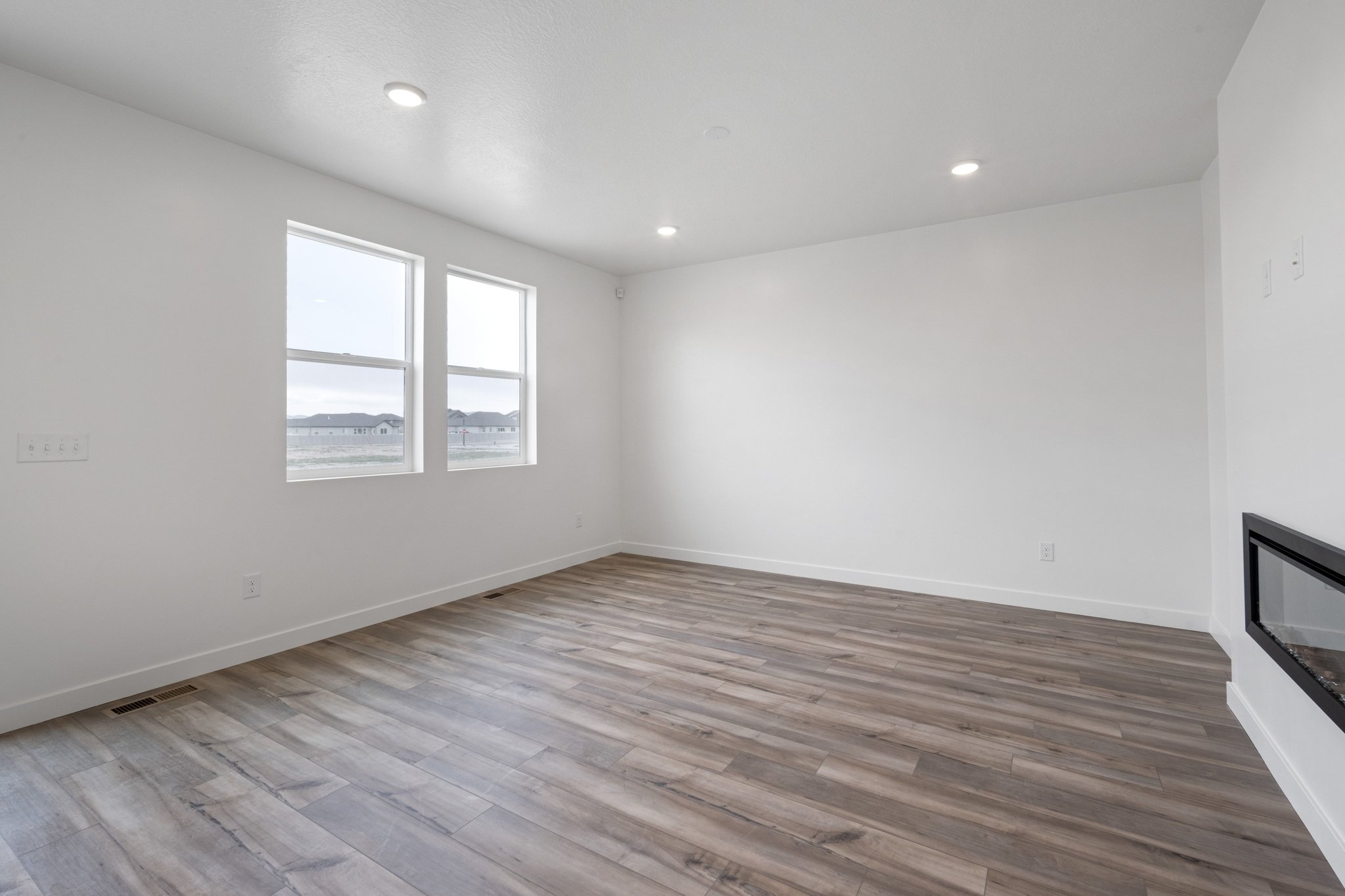 A room with a wood floor and a wood floor.