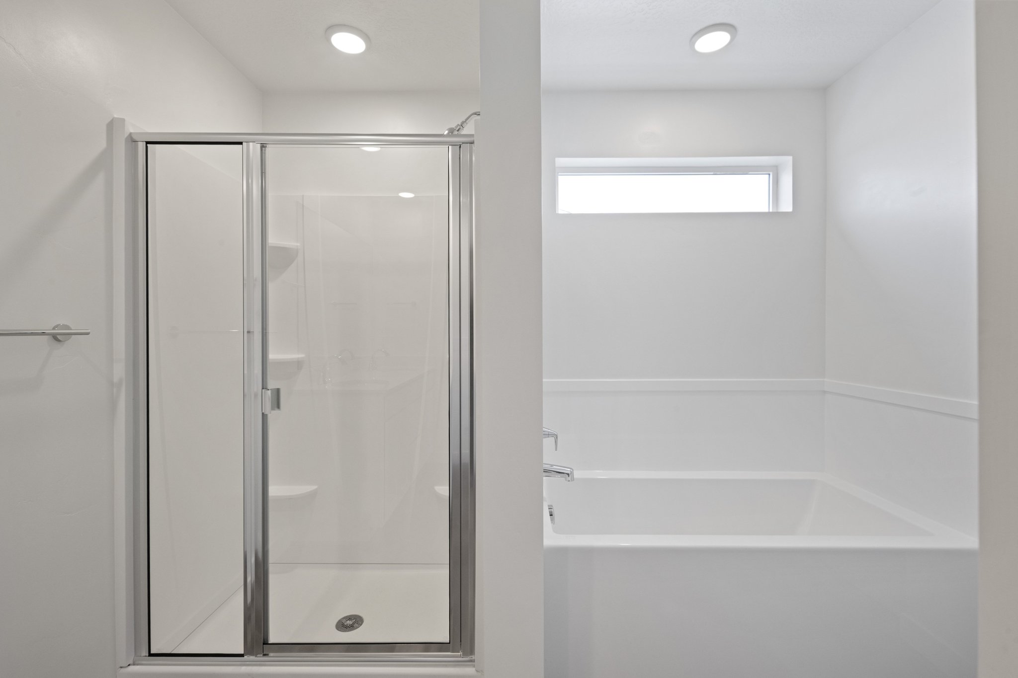 A bathroom with a glass shower.