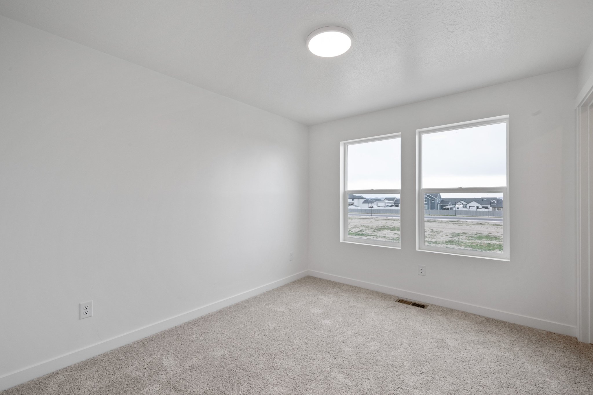 A room with a window and a light.