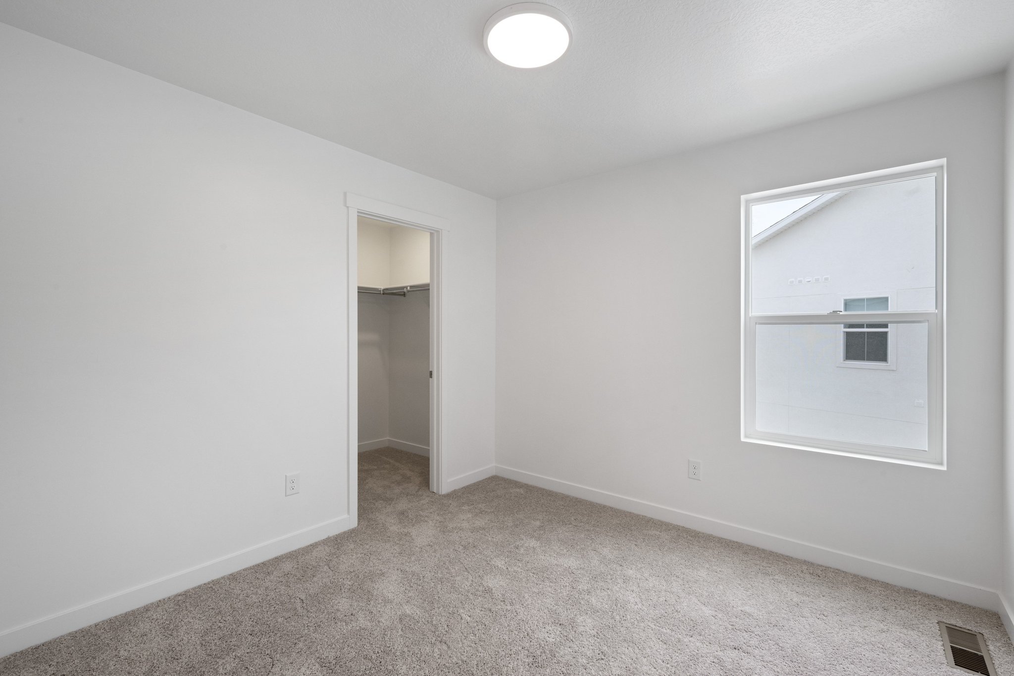 A room with a door and a window.