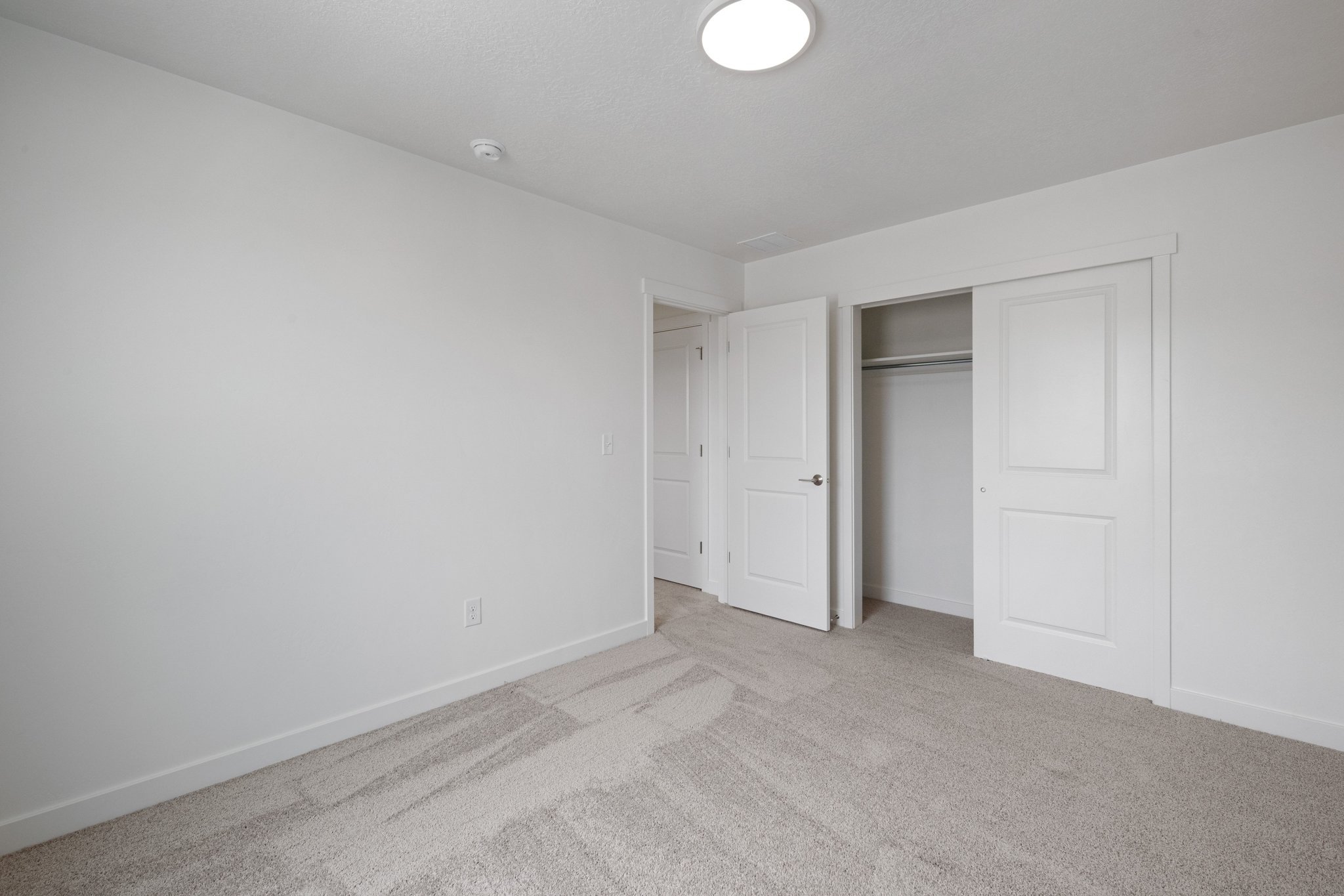 A room with white doors.