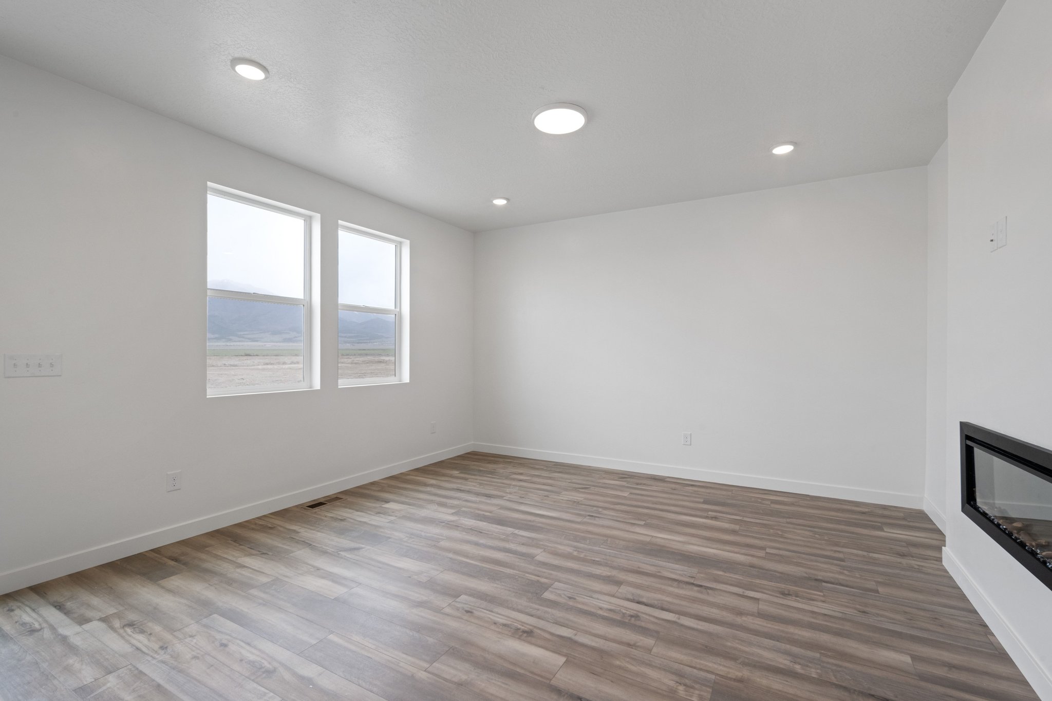 A room with a wood floor and a wood floor.