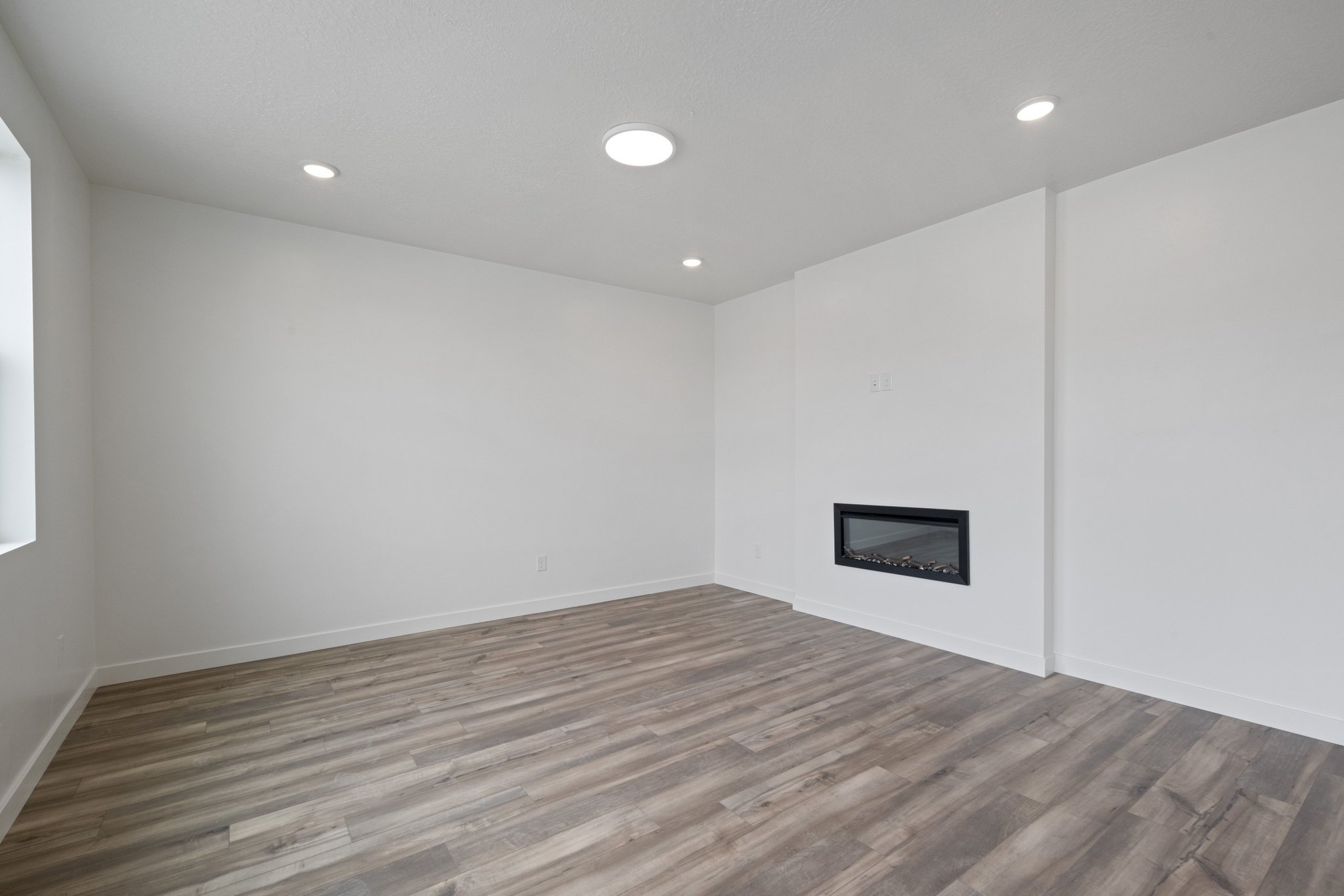 A room with a wood floor and a wood floor.