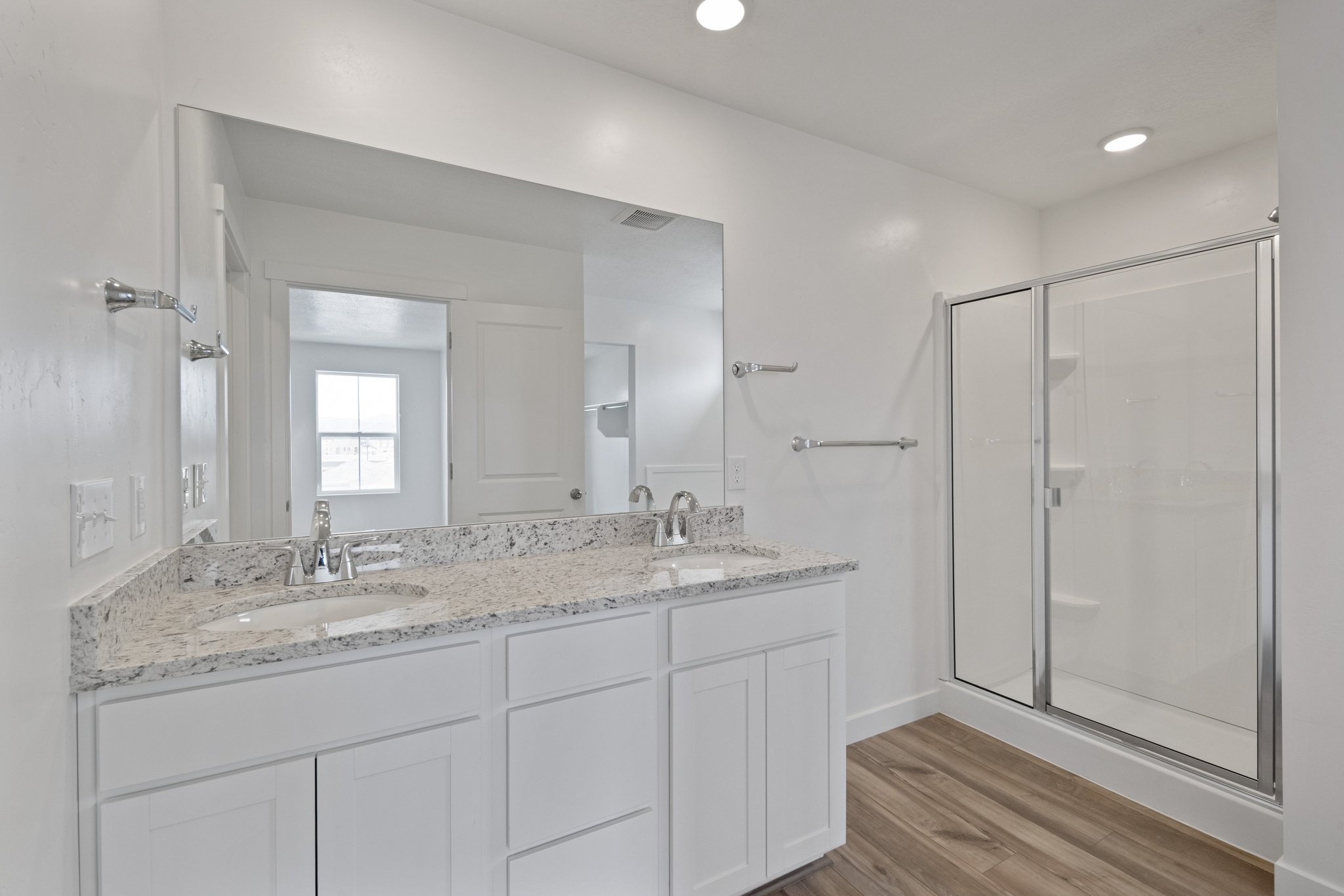 A bathroom with a marble countertop.