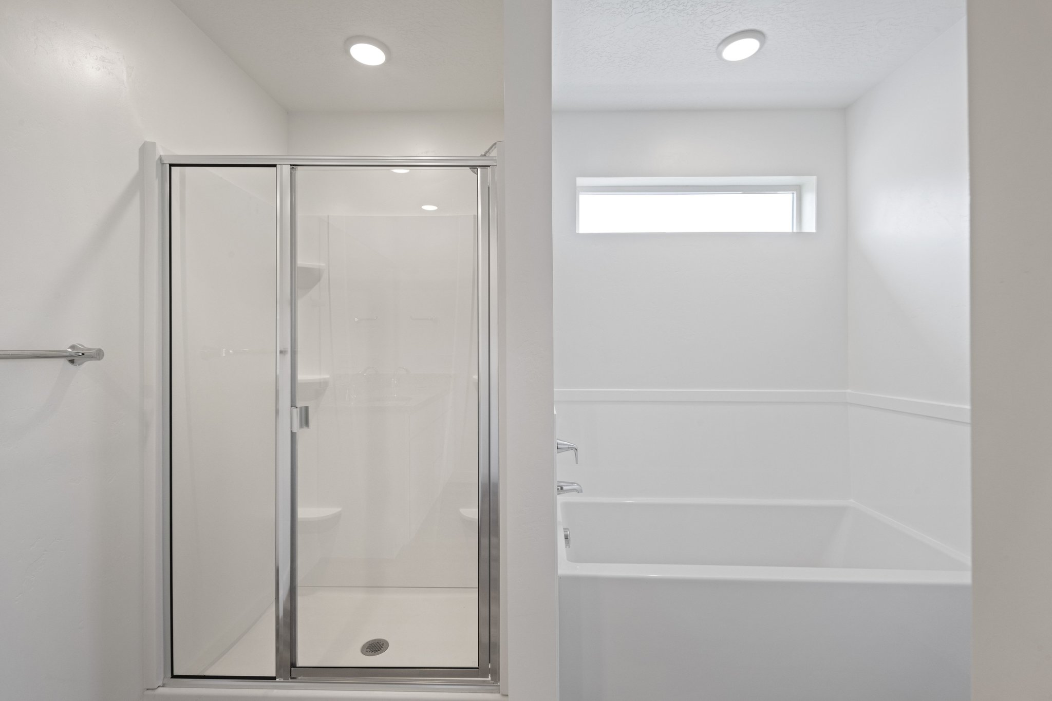 A bathroom with a glass shower.