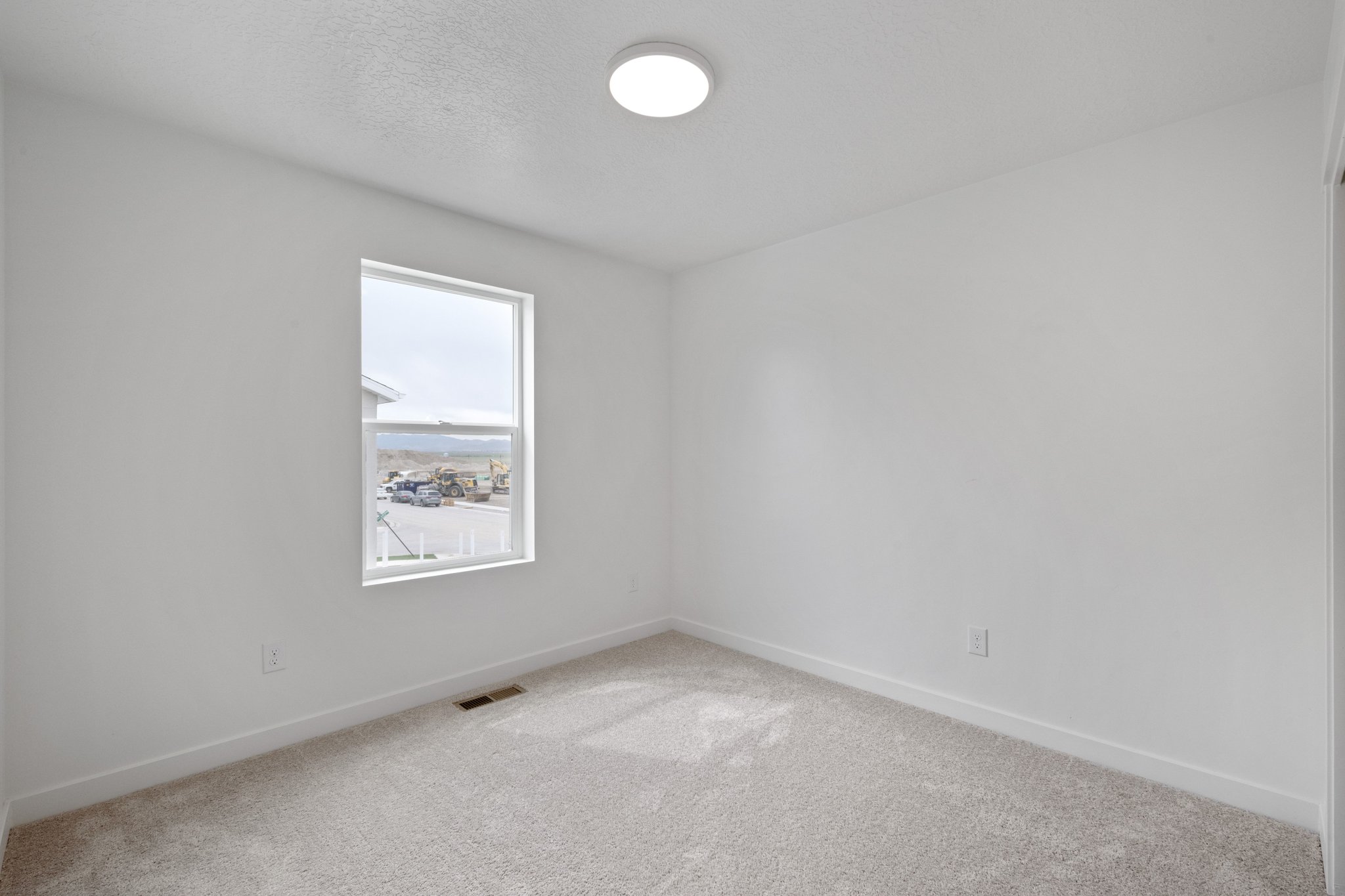 A room with a window and a light.