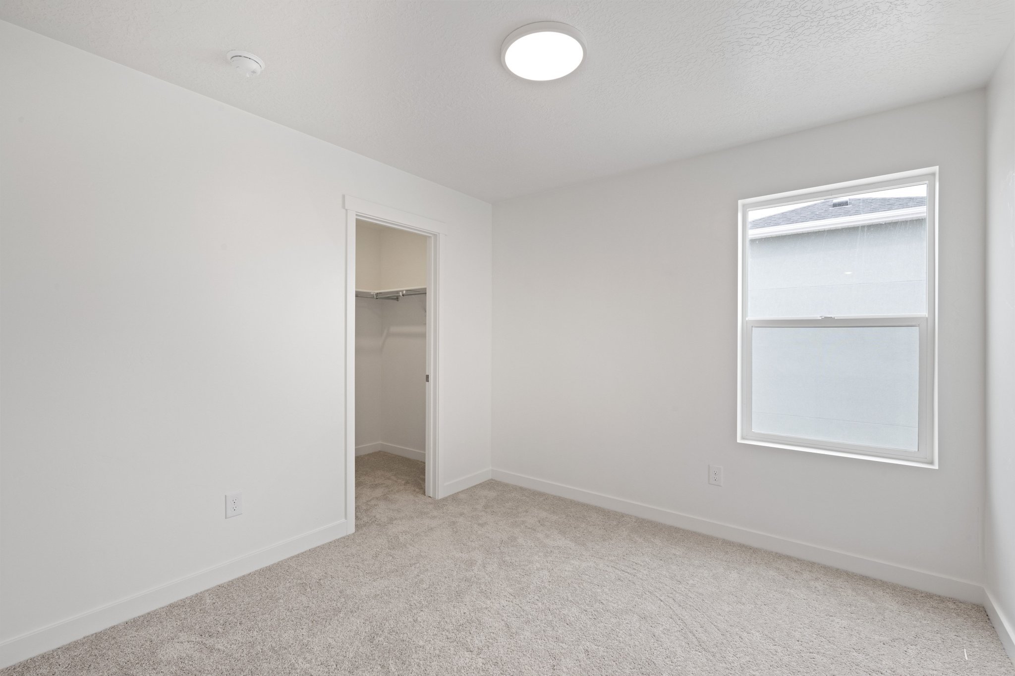 A room with a door and a window.