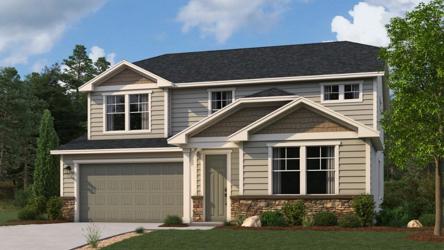 A house with a lawn in front of it.