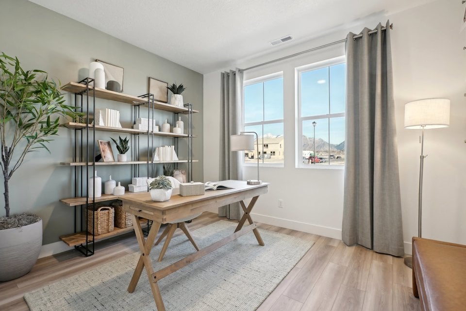 A room with a table and shelves.
