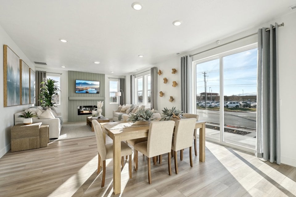 A dining room with a large window.