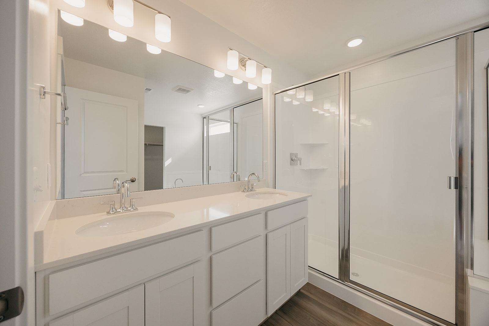A bathroom with a large mirror.