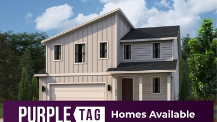 A house with trees in the back.