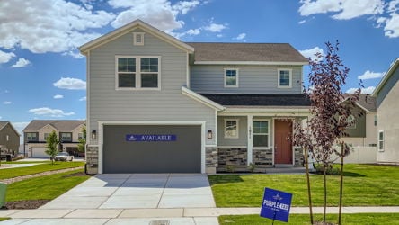 A building with a sign in front.