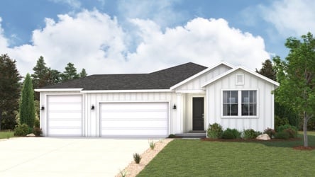 A white house with a garage.