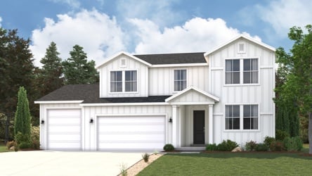 A white house with a driveway.