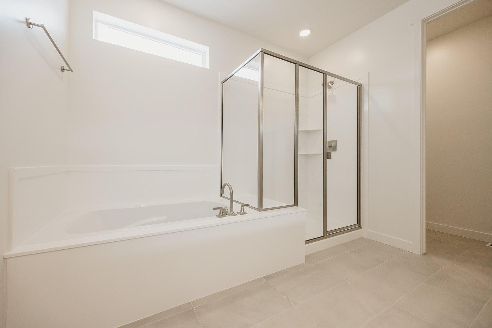 A bathroom with a glass shower.