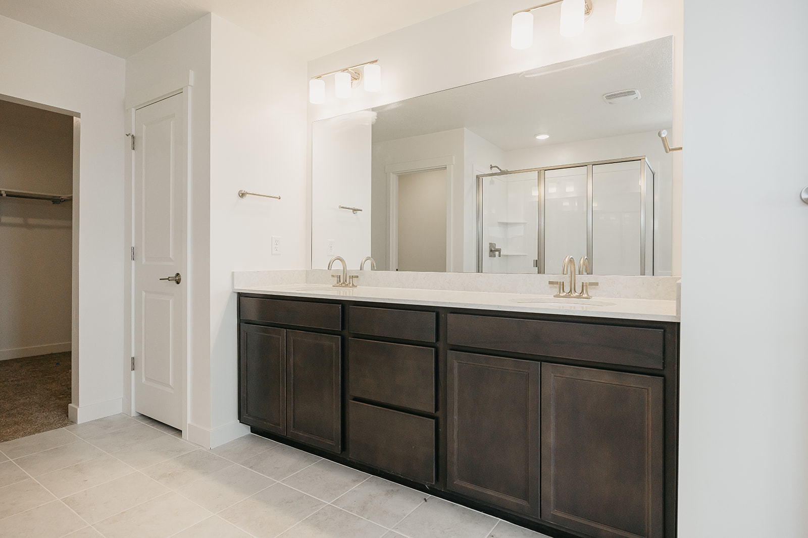 A bathroom with a large mirror.