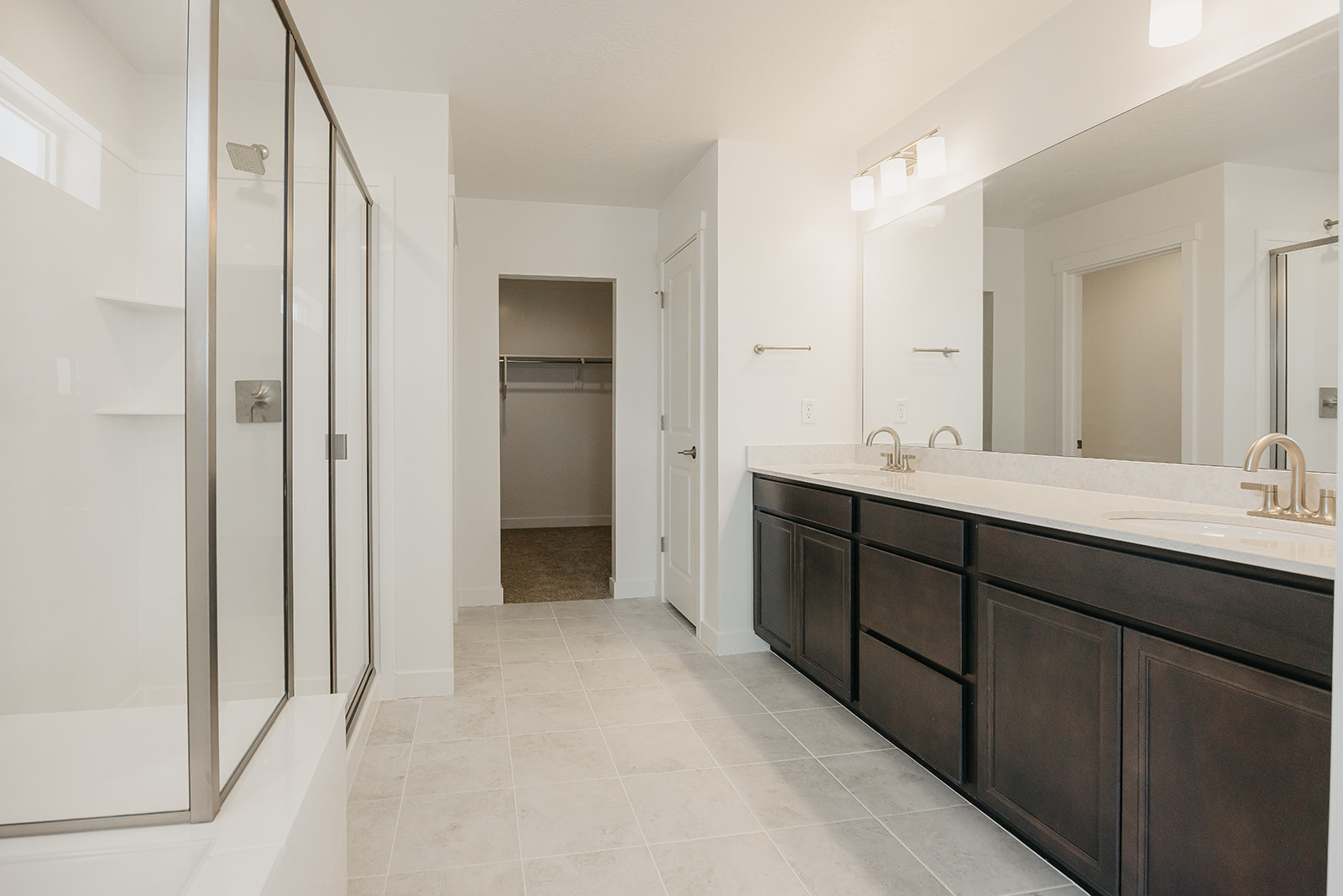 A bathroom with a large mirror.
