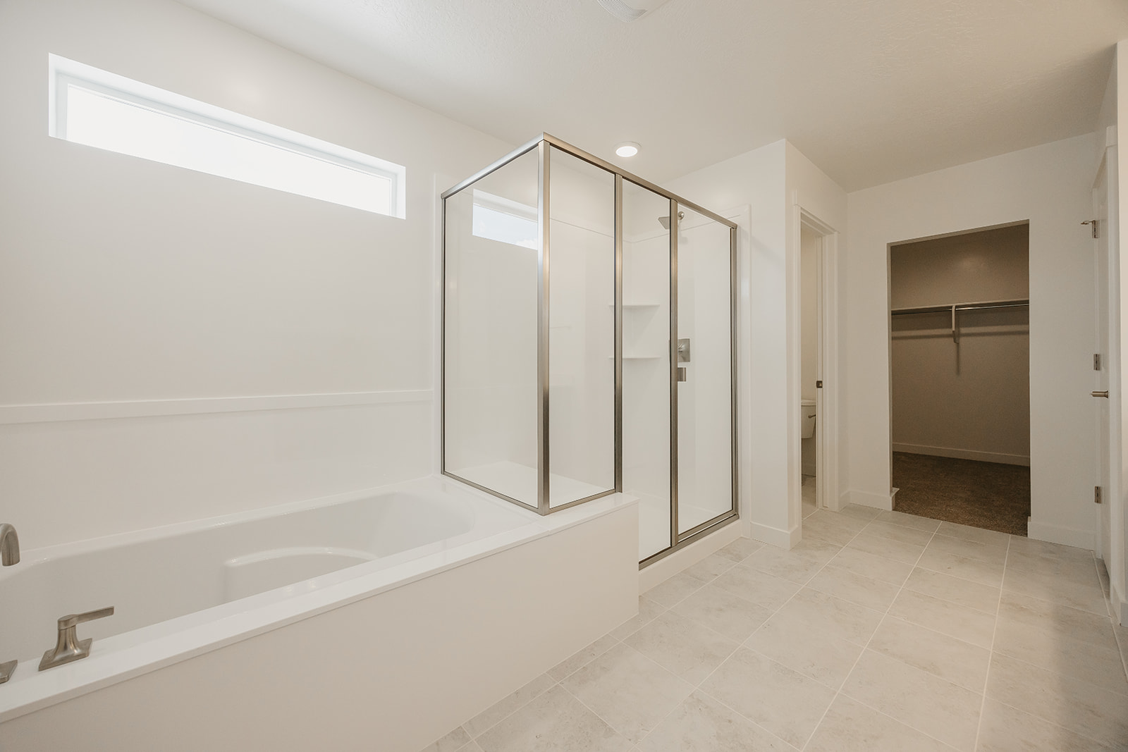 A bathroom with a bathtub and shower.