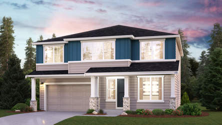 A house with a garage and a lawn in front of it.