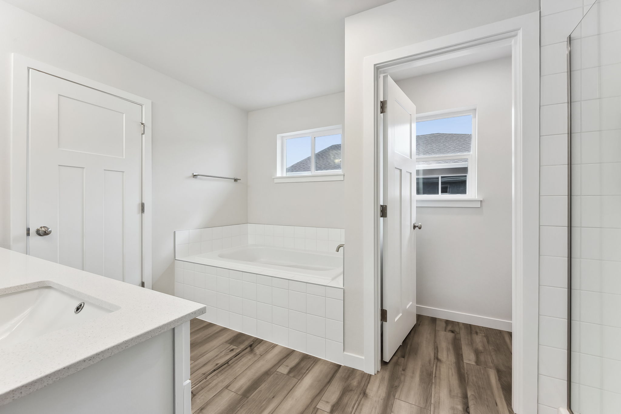 A bathroom with a tub and sink.