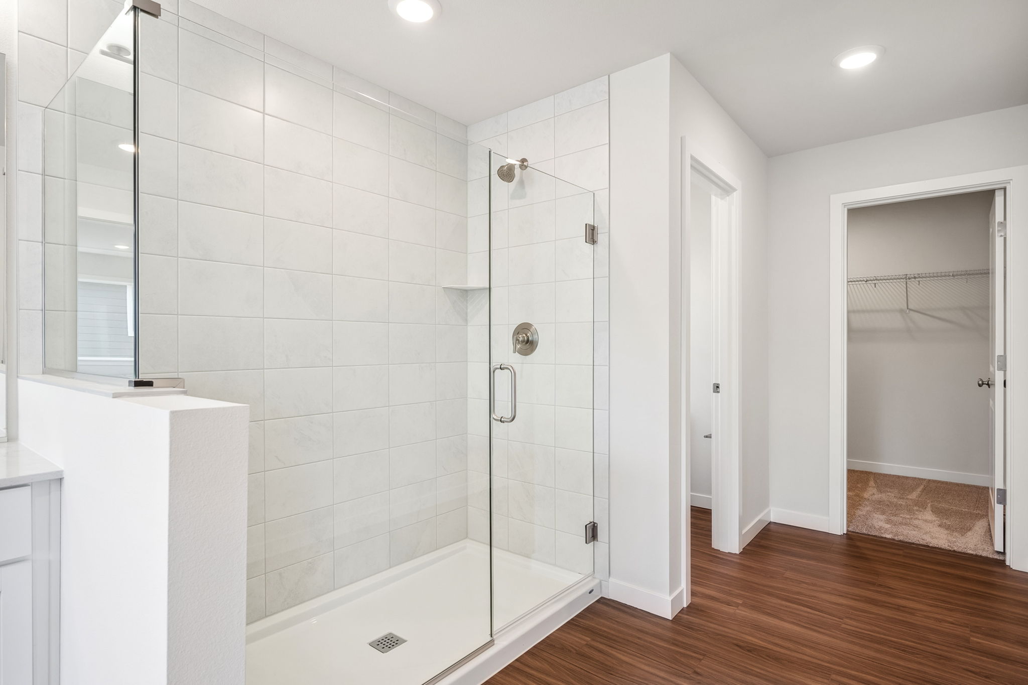A bathroom with a glass shower.