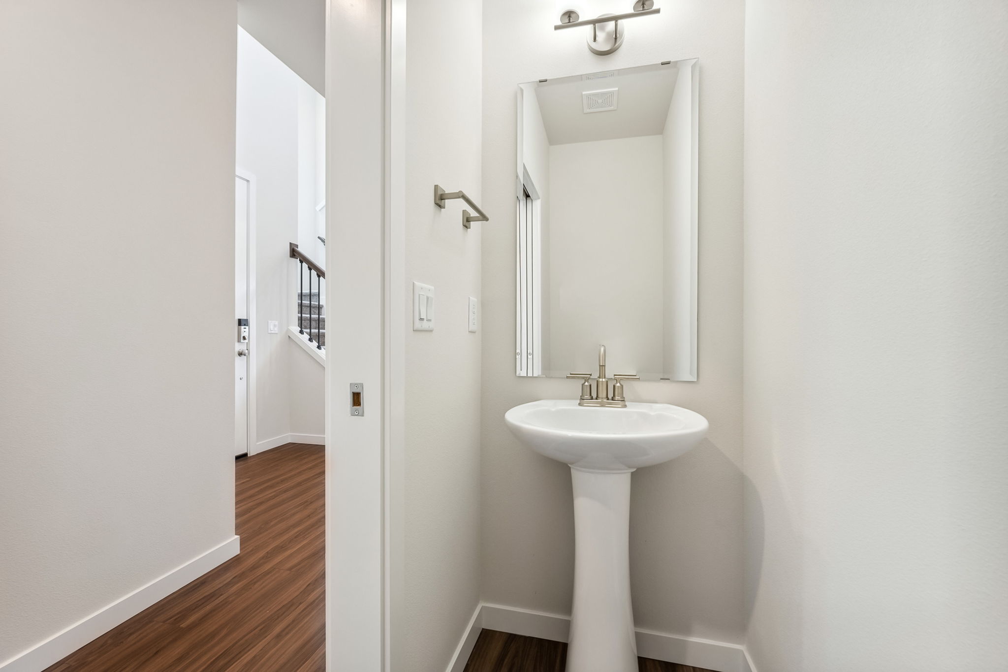 A bathroom with a sink and mirror.