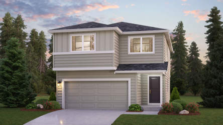 A house with a garage and trees around it.