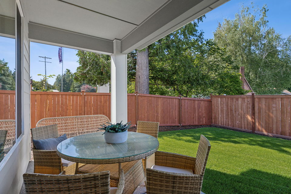 A patio with a table and chairs.