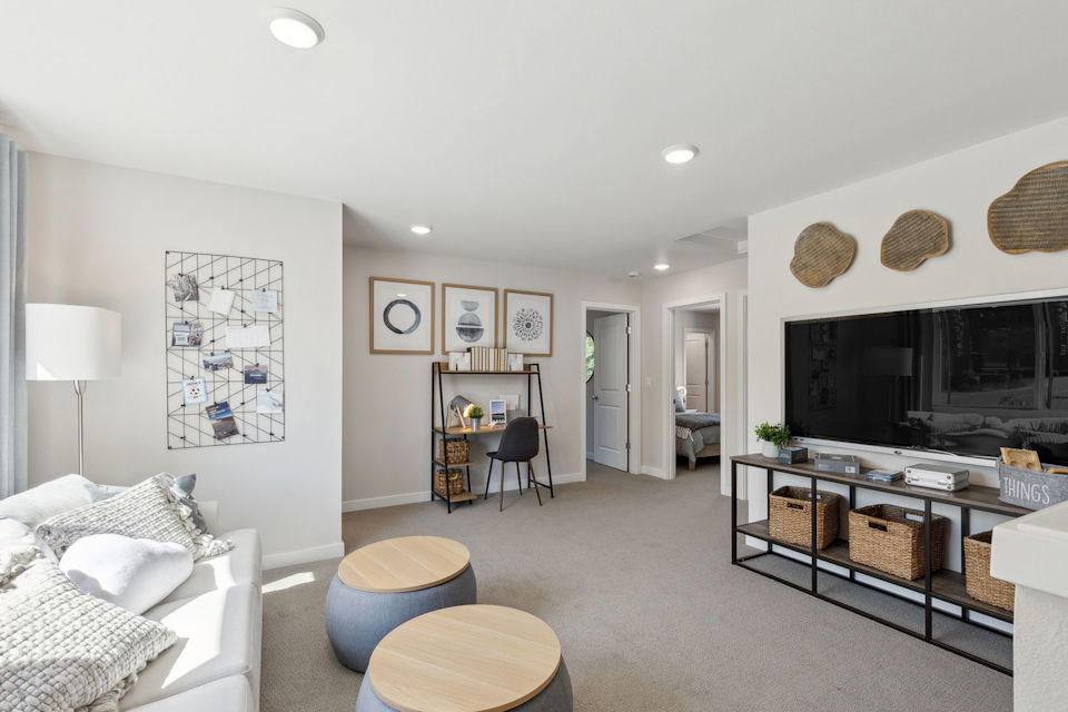 A living room with a tv and furniture.