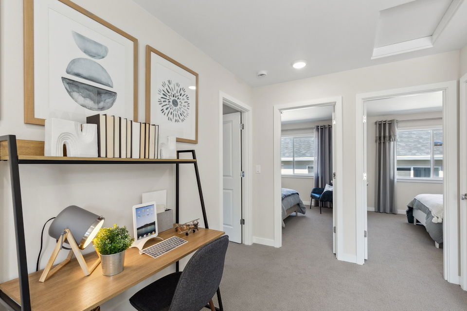 A room with a desk and a computer.