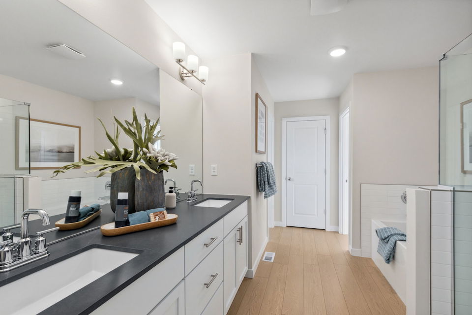 A bathroom with a countertop sink and a mirror.