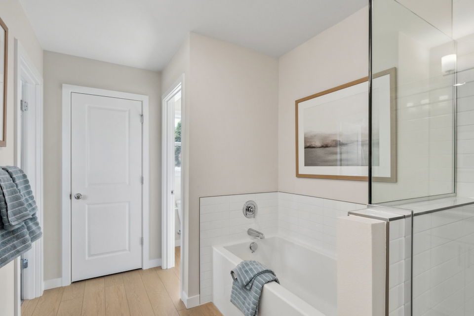 A bathroom with a tub and sink.