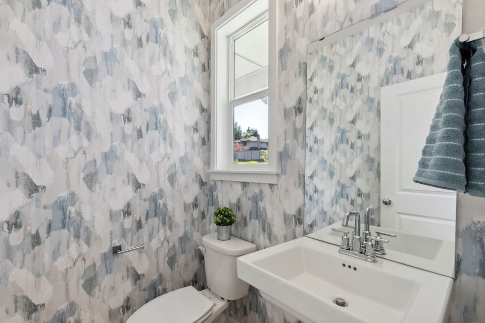 A bathroom with a sink and a toilet.