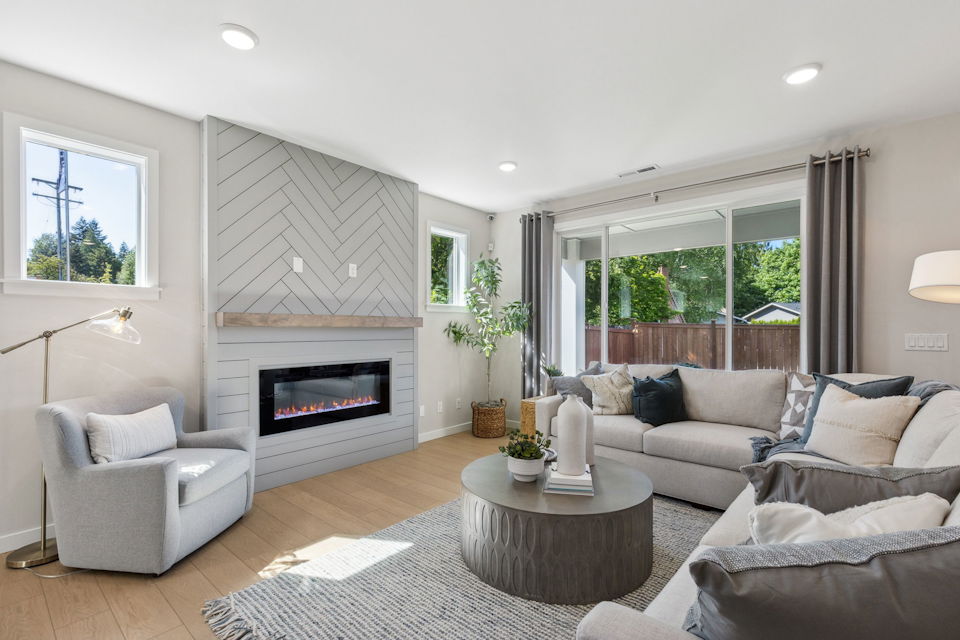 A living room with a fireplace.