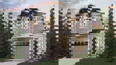 A house with a garage and trees around it.