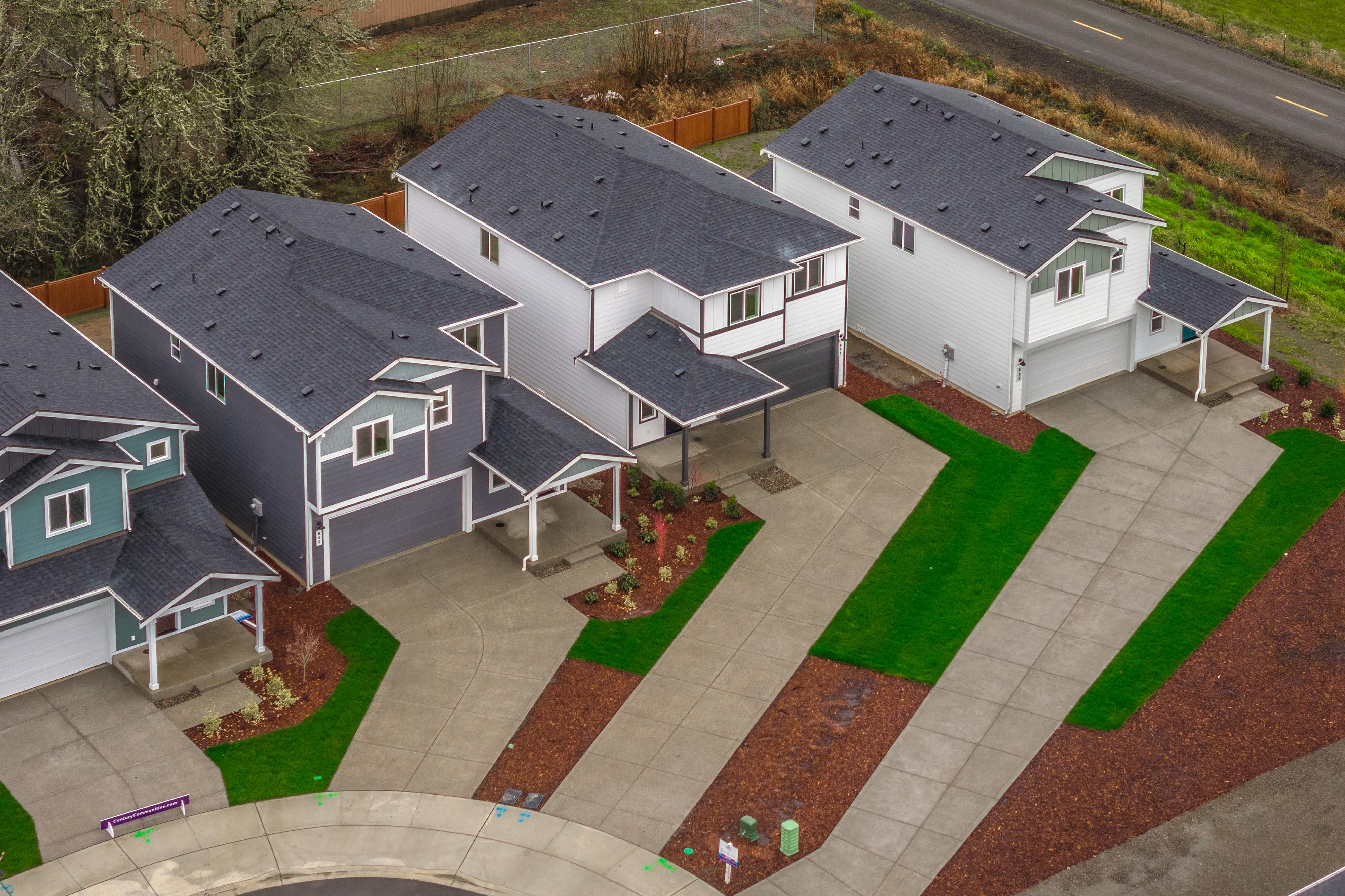 A building with a lawn and a basketball court.