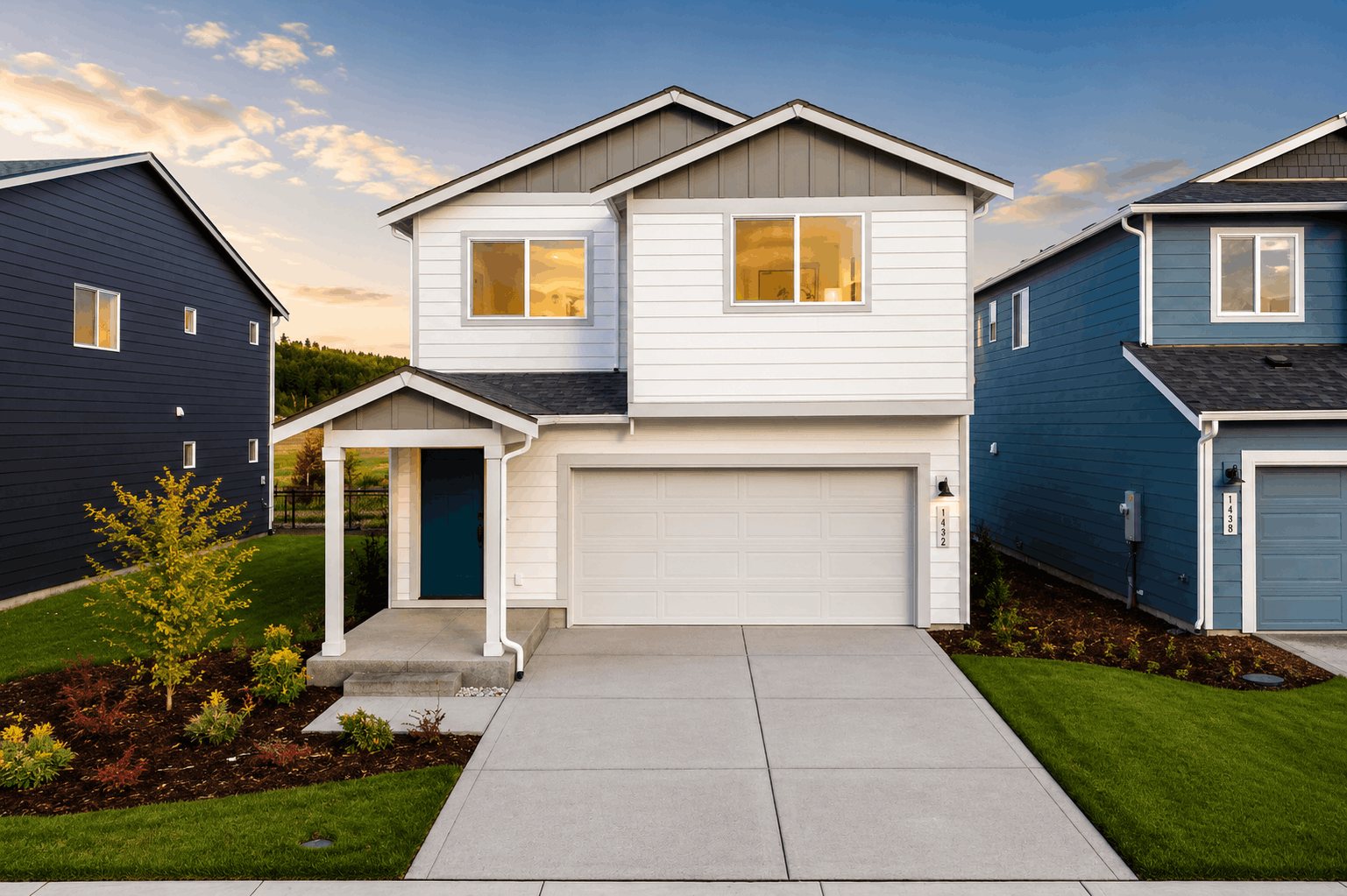 A house with garages and a driveway.