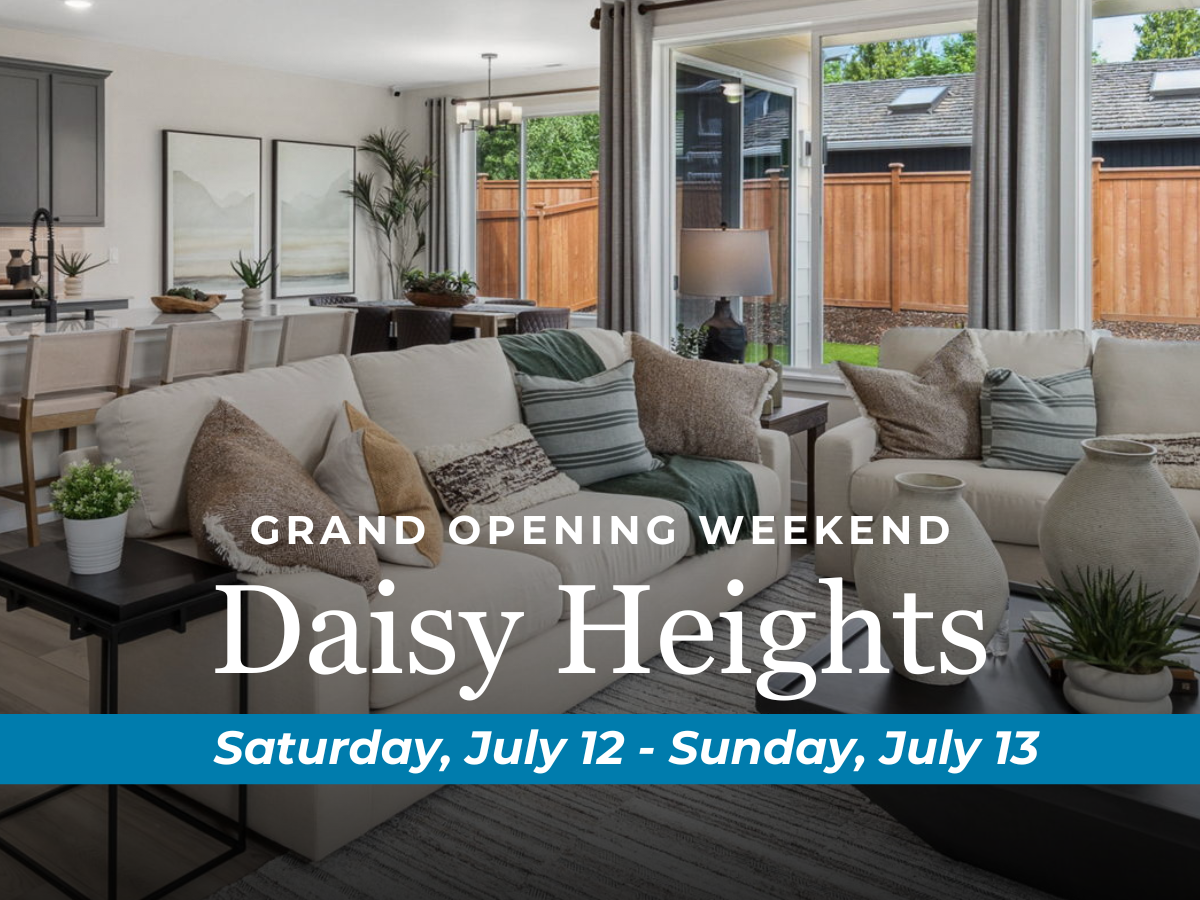 A room with a couch and a table with plants.