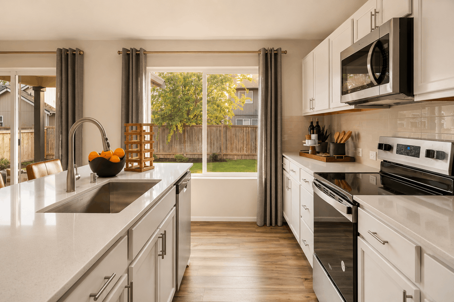A kitchen with white cabinets.