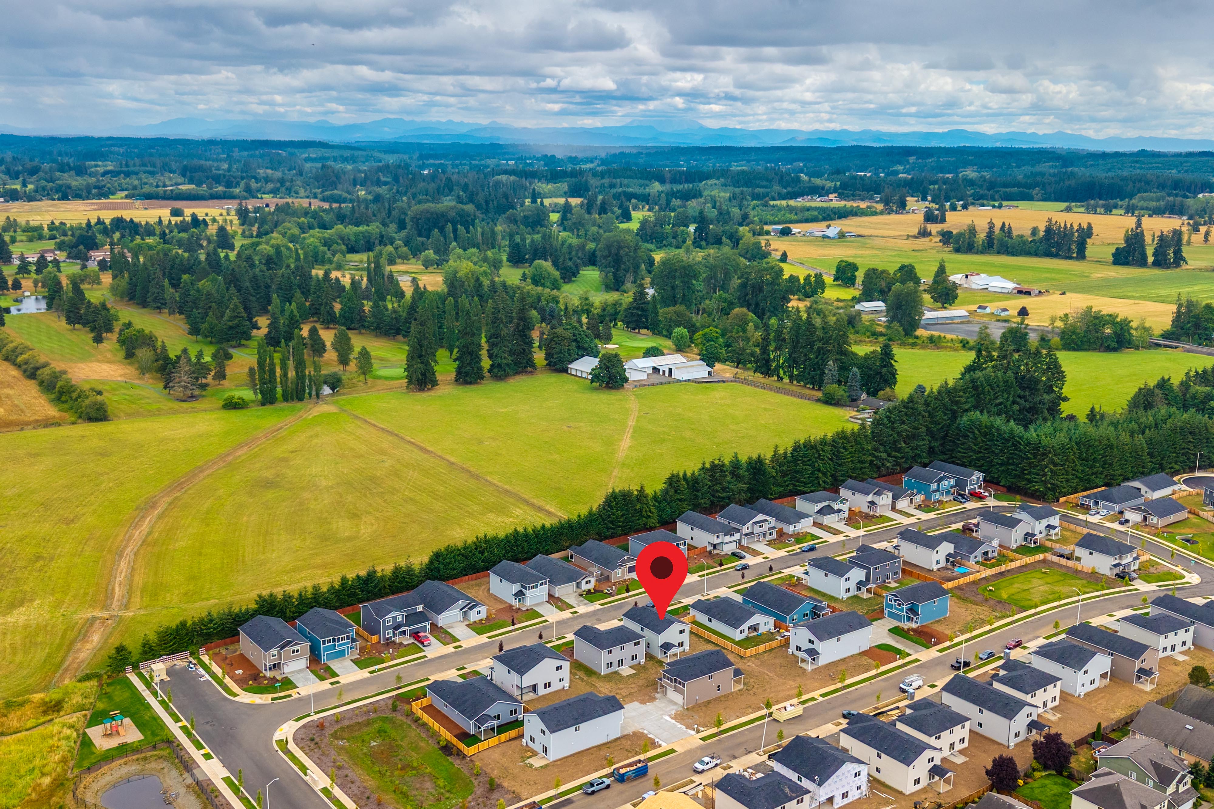 A group of houses in a field.