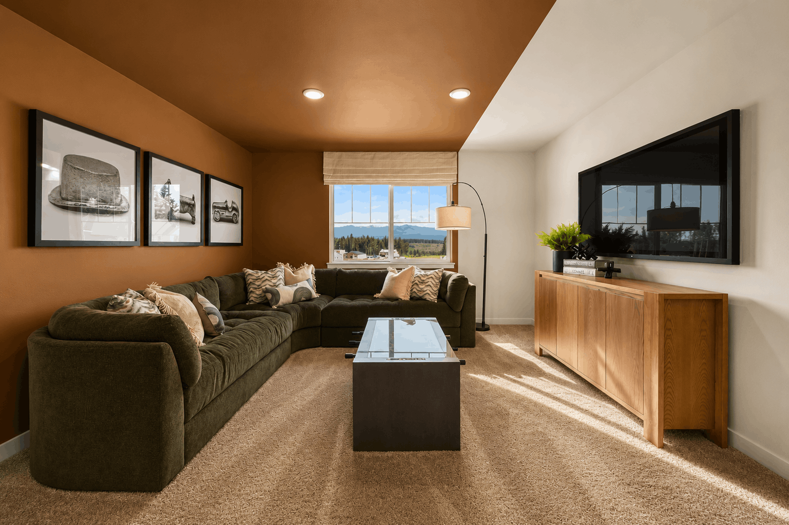 A living room with a large television.
