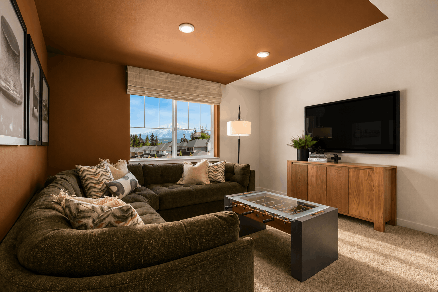 A living room with a tv and couches.