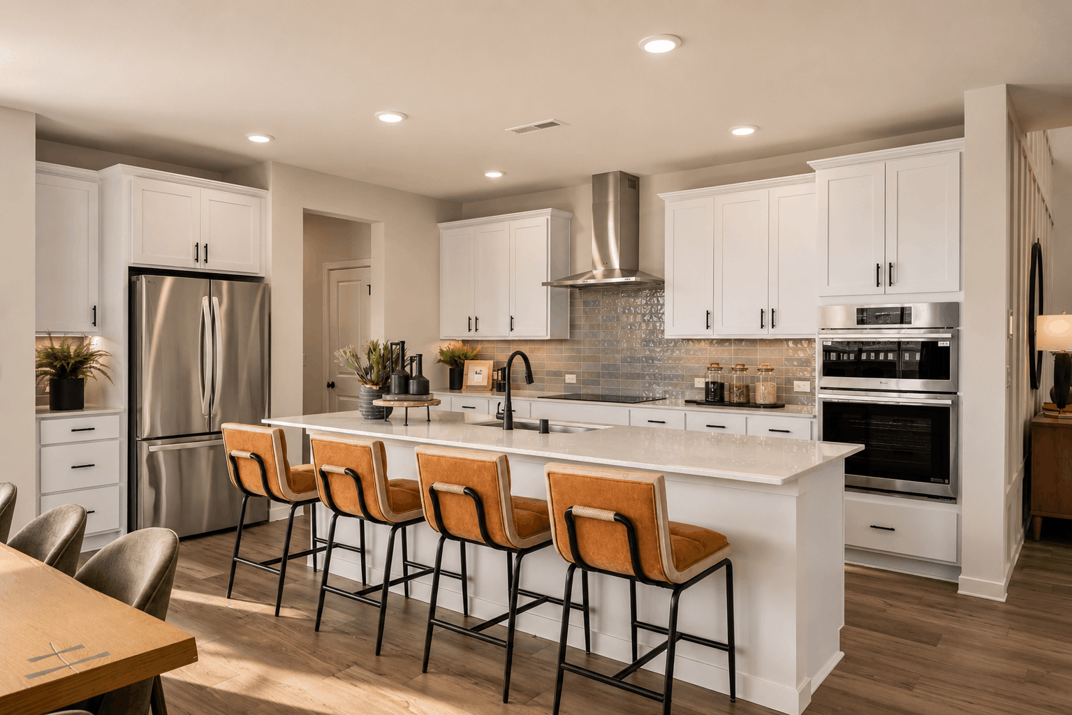 A kitchen with white cabinets.