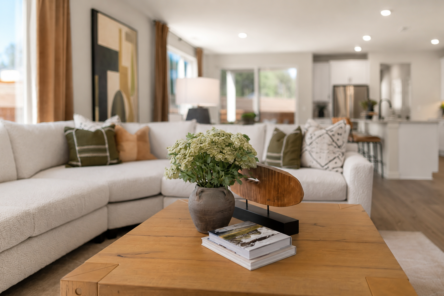 A living room with a white couch and a coffee table.