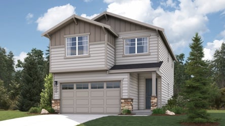 A house with a garage and trees.