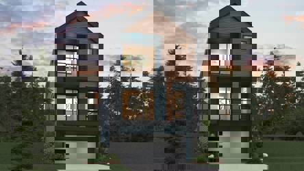 A house with a garage and trees around it.